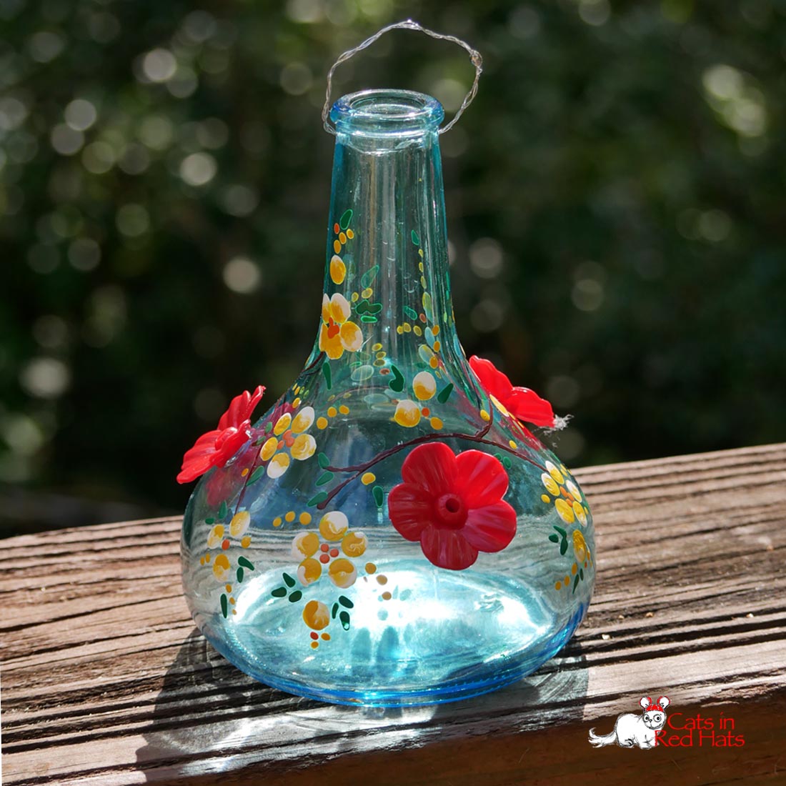 Hummingbird Feeder with red and yellow flowers