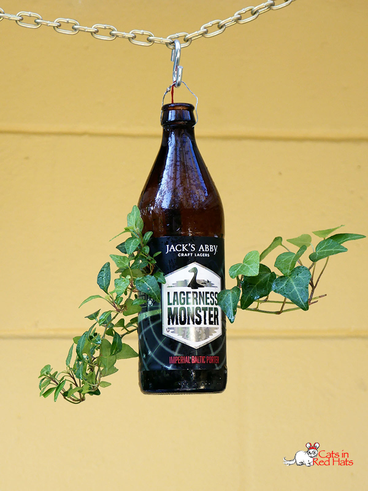Lagerness Monster beer bottle with holes in sides for plants
