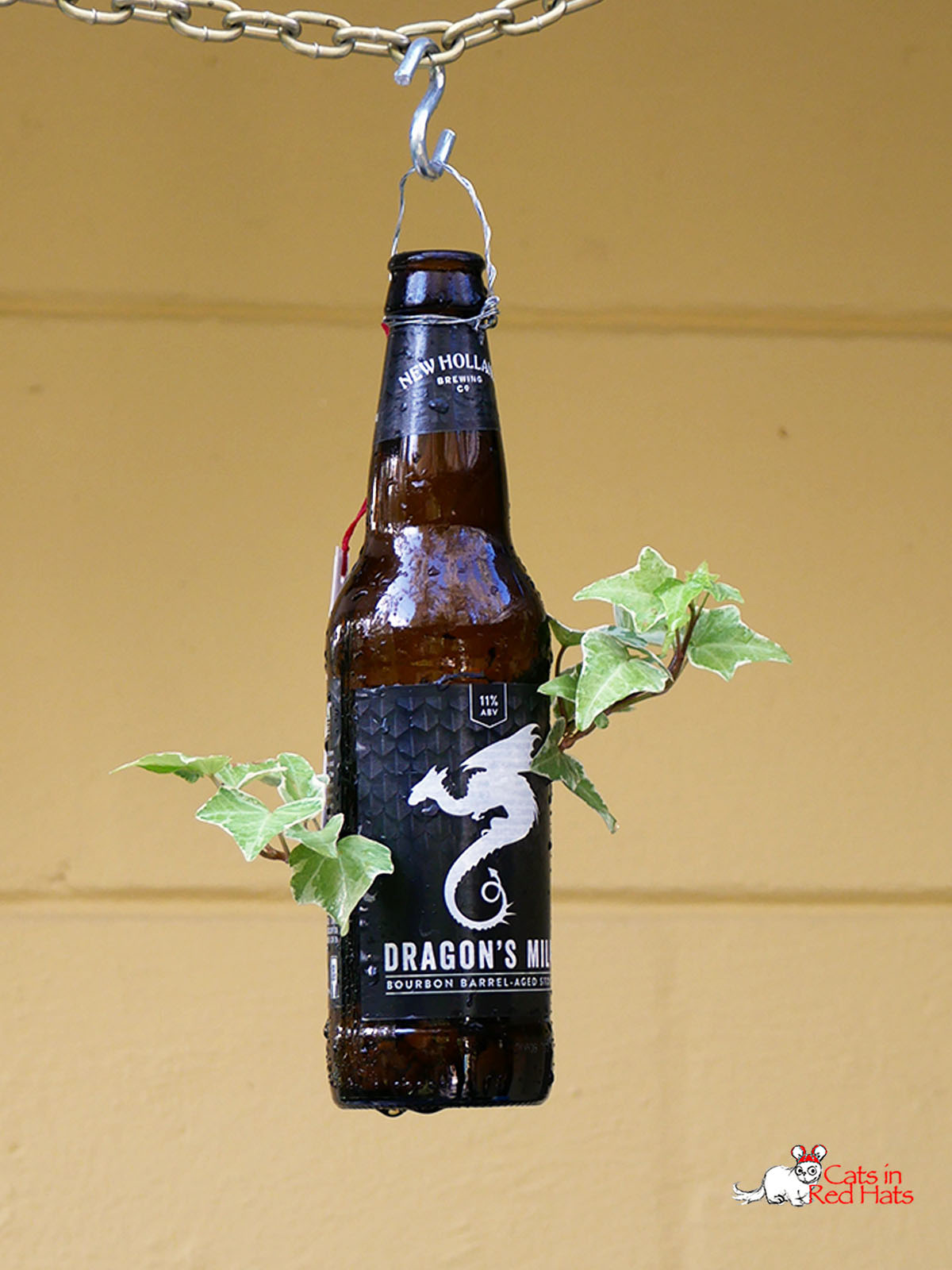 Dragon's Milk Beer bottle with holes in side for plants